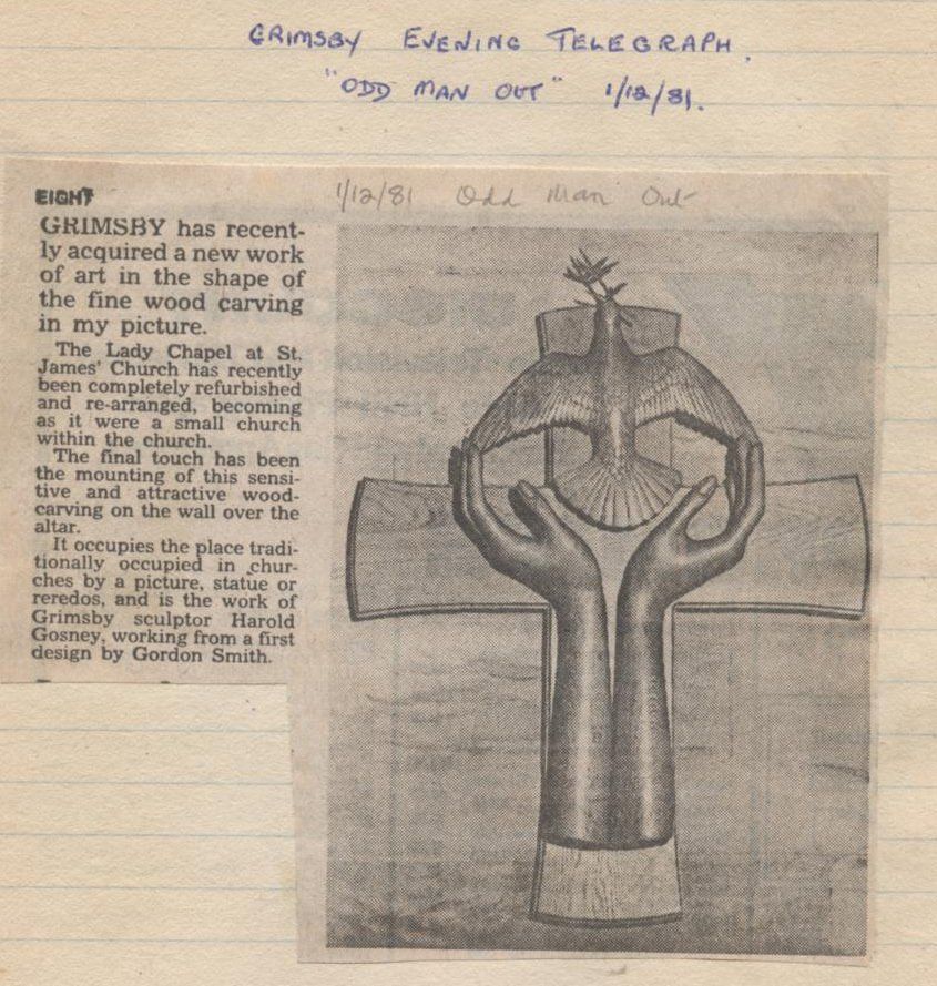 Newspaper clipping: wood carving of hands holding a dove on a cross, article titled 