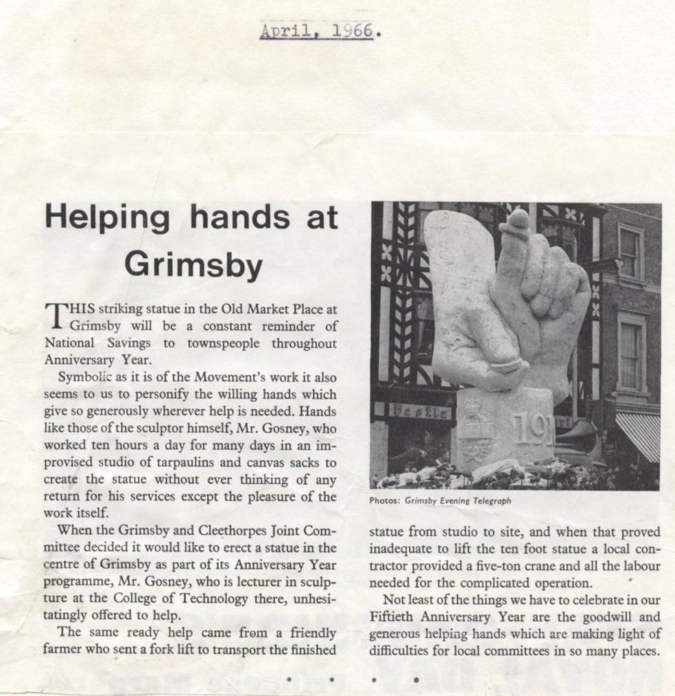 Newspaper clipping of a sculpture of two hands, 