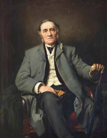 Portrait of an older man seated, wearing a gray coat, holding a cane and gloves.