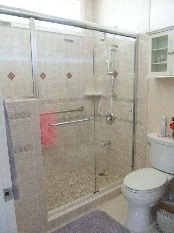 Toilet Bowl Beside The Shower Door — Hilo, HI — Alumside Products Inc