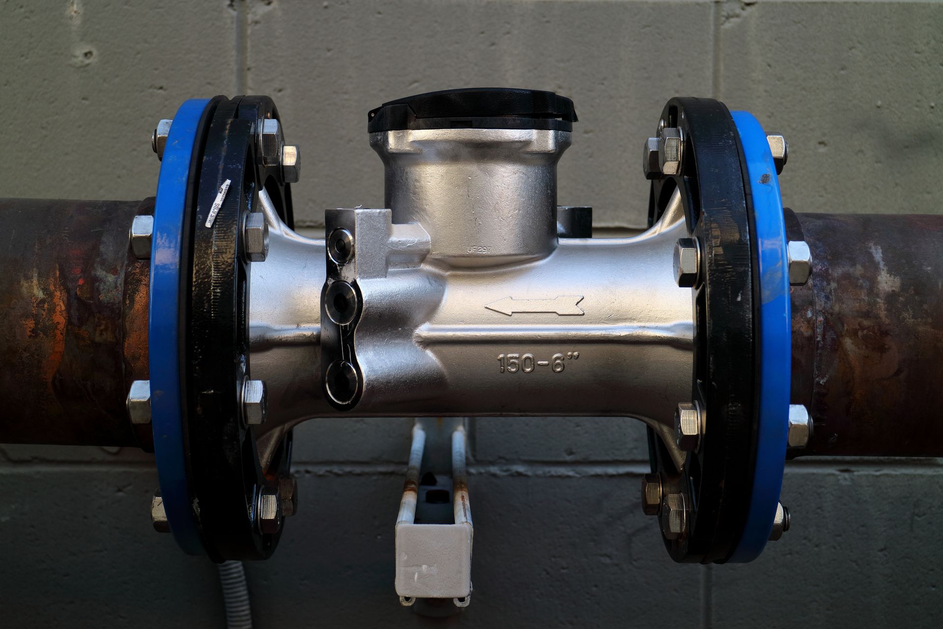 A close up of a metal pipe with a lock on it