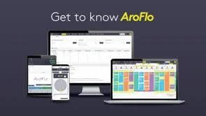 AroFlo software displayed on various devices: tablet, phone, desktop computer, and laptop, against a dark blue background.