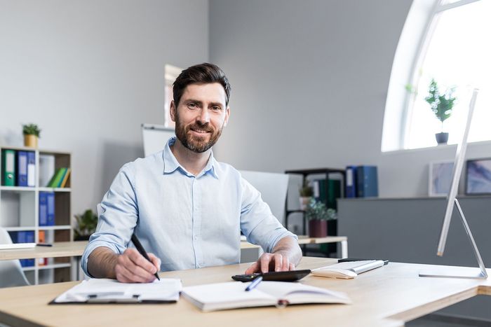 a man sitting at a desk in an office