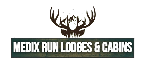 Logo for Medix Run Lodges & Cabins featuring a dark deer antler silhouette with a mountain range inside, above the text.