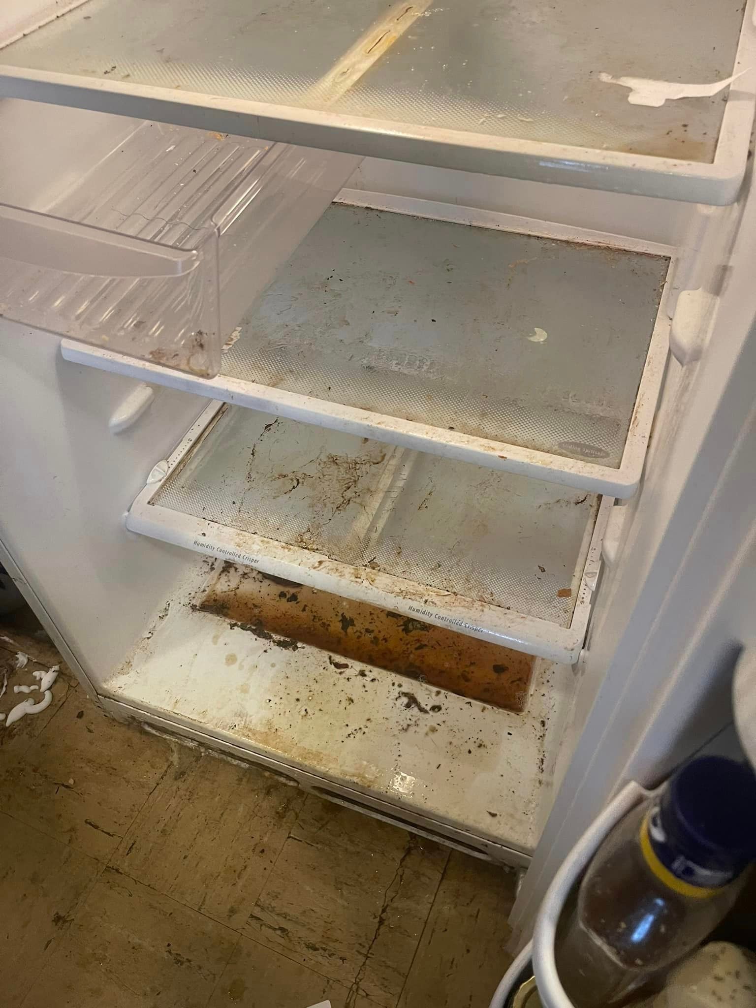 Before is a dirty refrigerator with a bottle of soda on the floor
