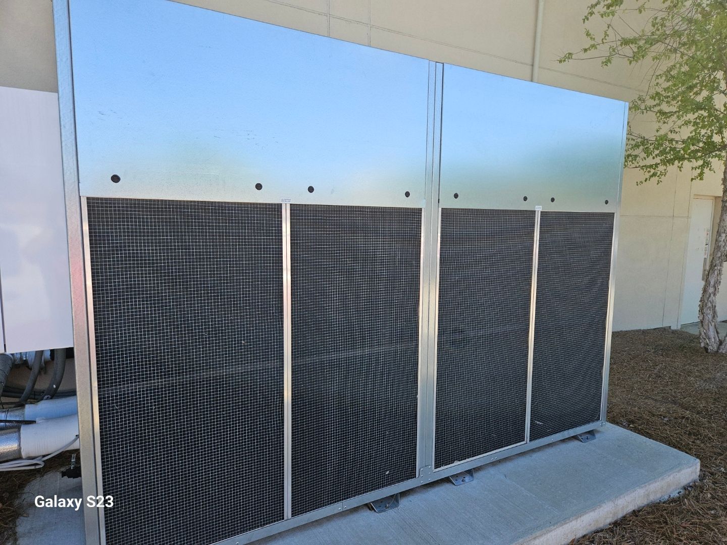 A galaxy s13 is sitting in front of a building