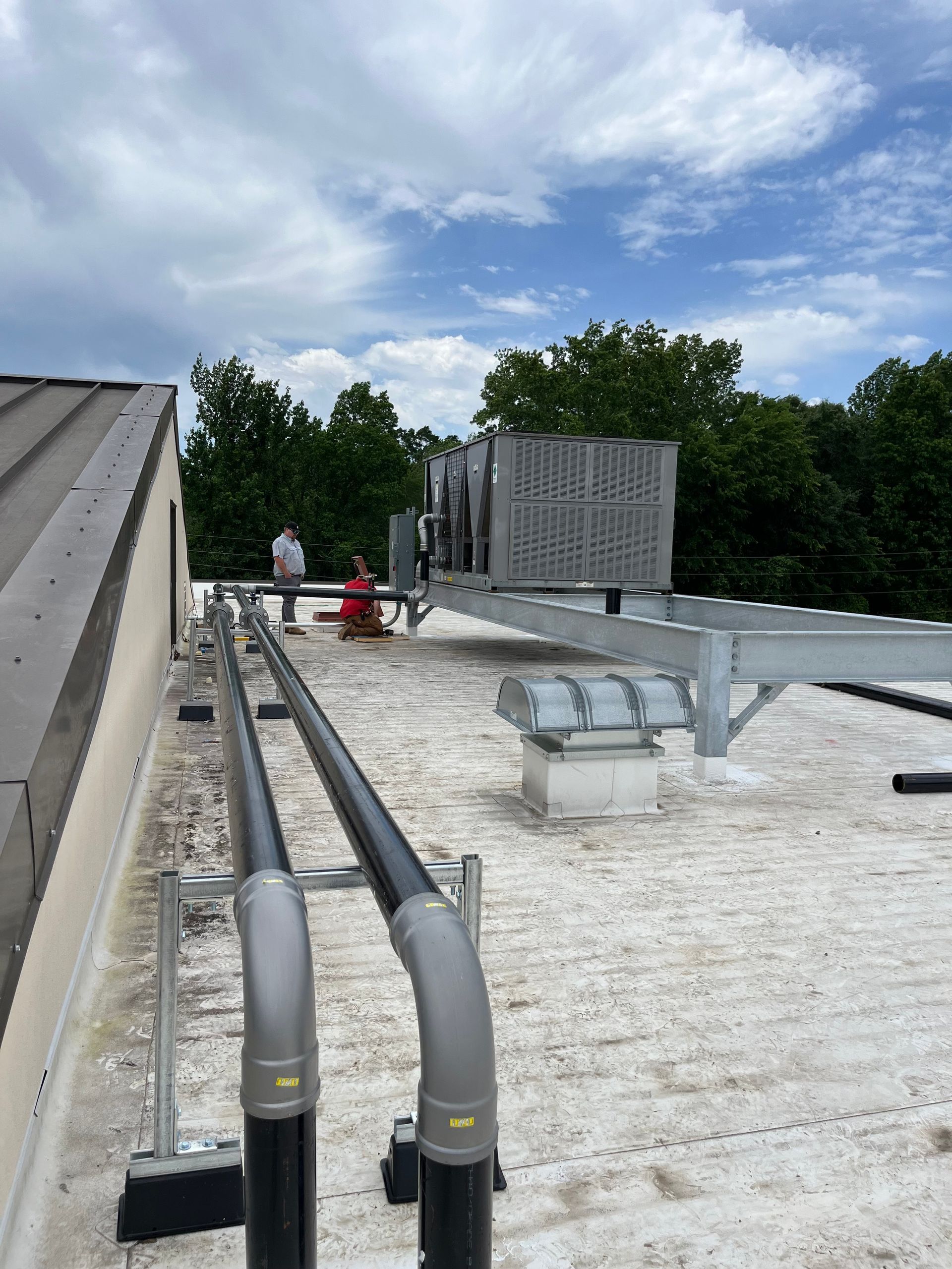 A roof with a lot of pipes on it