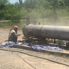 Welder working on pipeline
