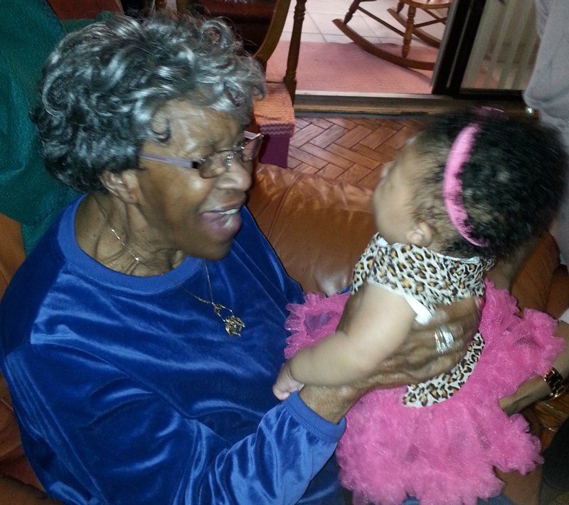 Grandmother smiling at baby - The Umbrella Insurance in Bowie, MD