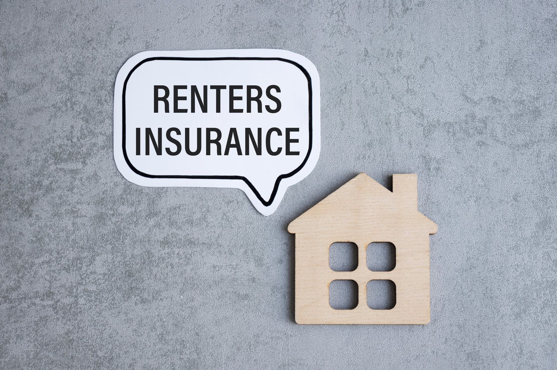 small wooden house with speech bubble reading renters insurance