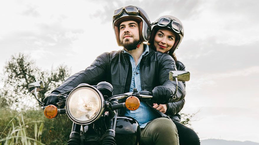 couple on a motorcycle are protected by motorcycle insurance
