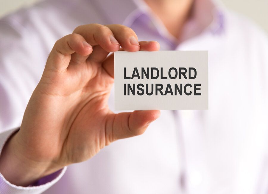 close up of small paper reading Landlord Insurance