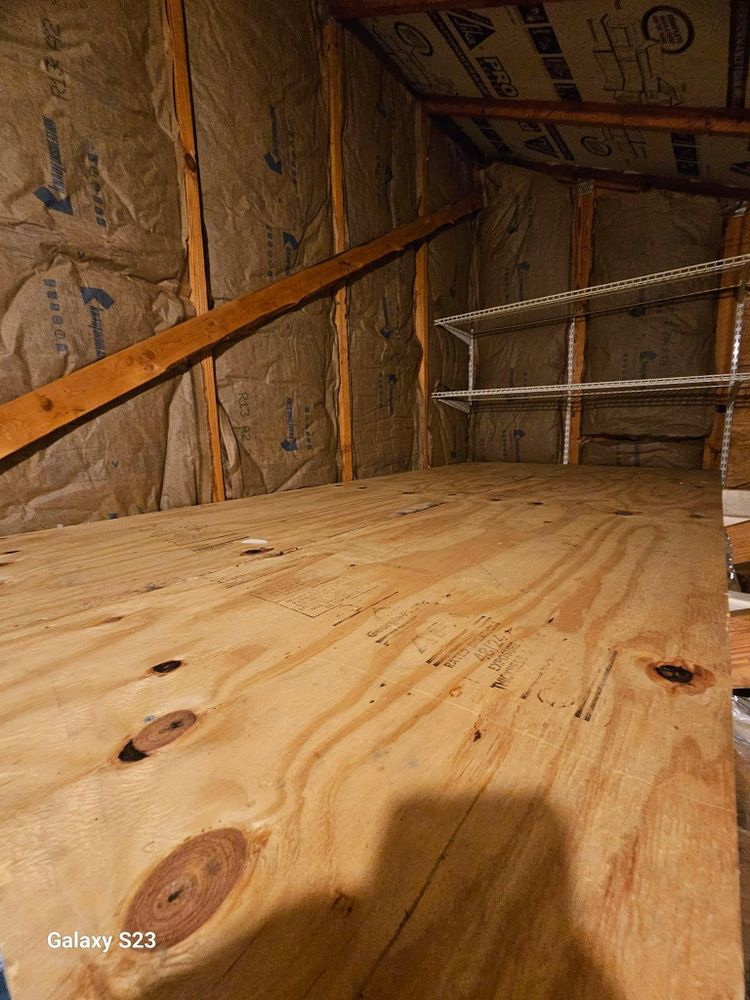 There is a wooden floor in the attic with insulation.