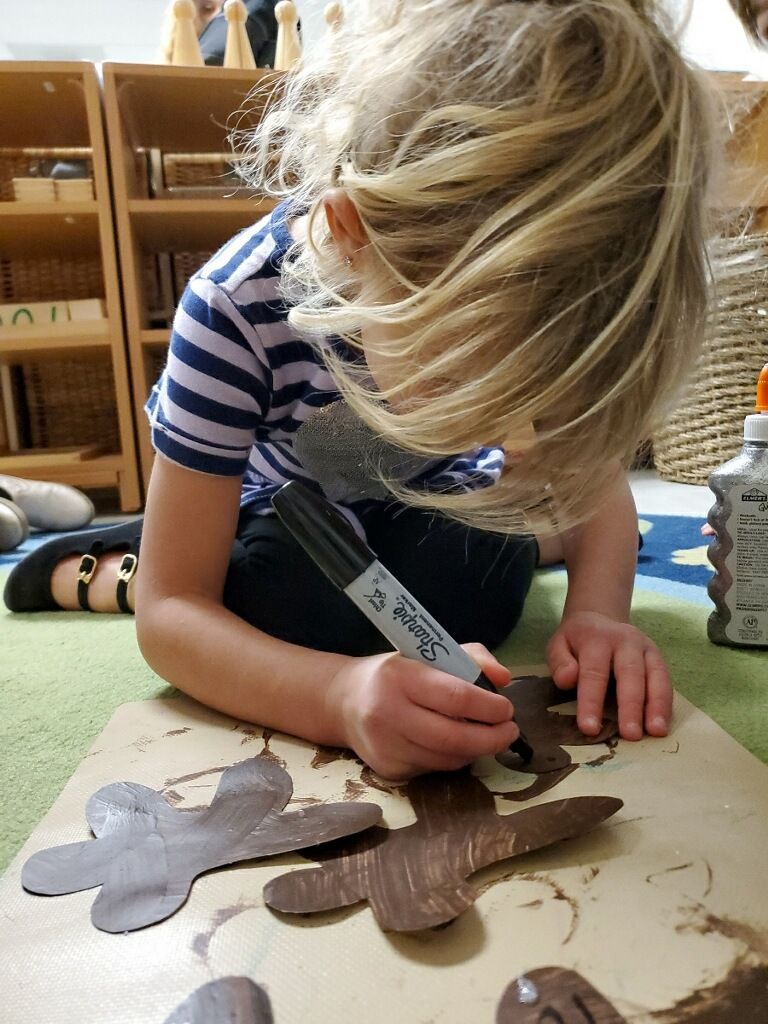 A montessori child working in the classroom