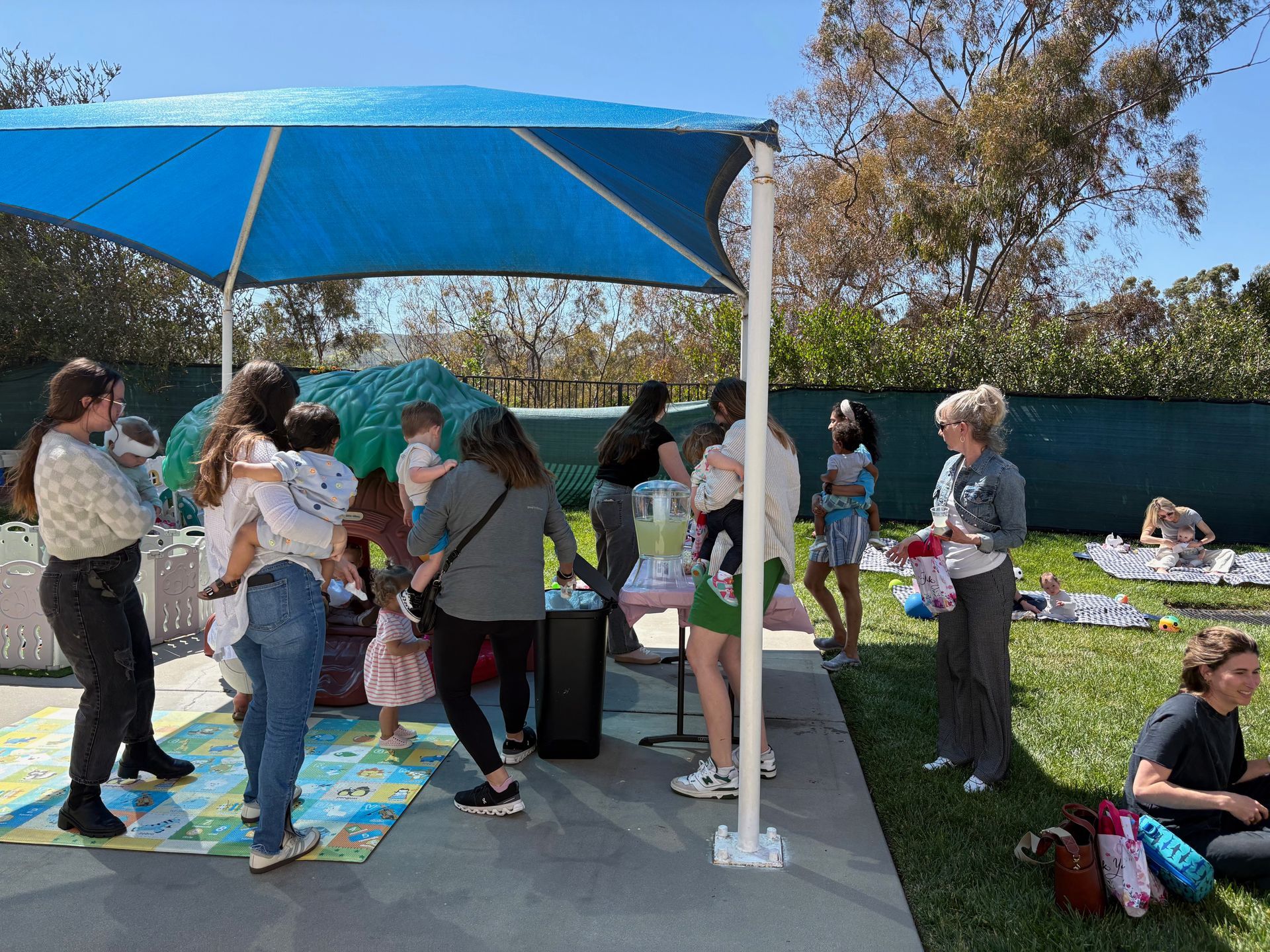 A group of montessori infants and mothers celebrating the mothers day