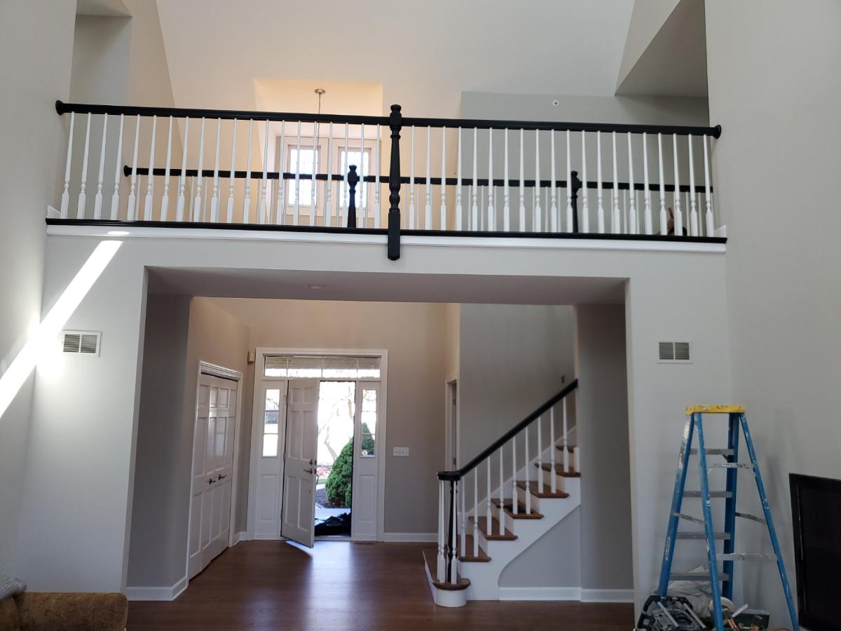 An empty house with a balcony and stairs