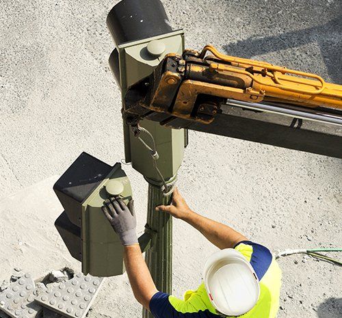 View of professional repairing the lights