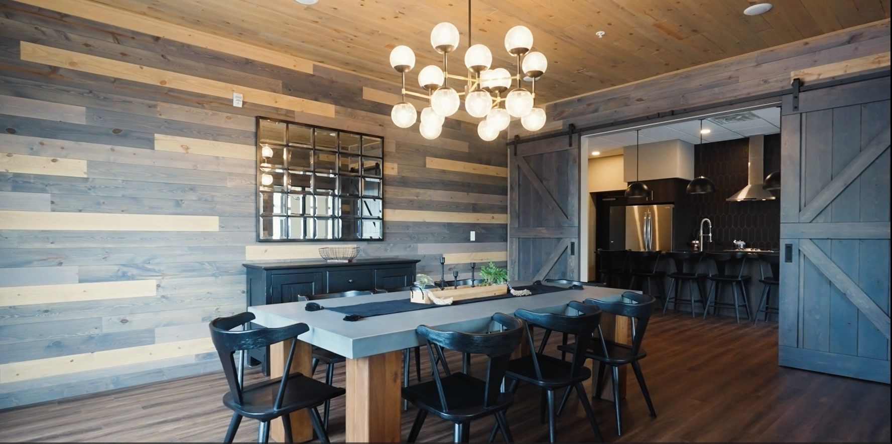 a dining room with a large table and chairs