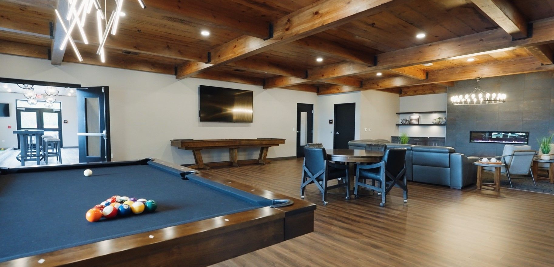 there is a pool table in the middle of the room .