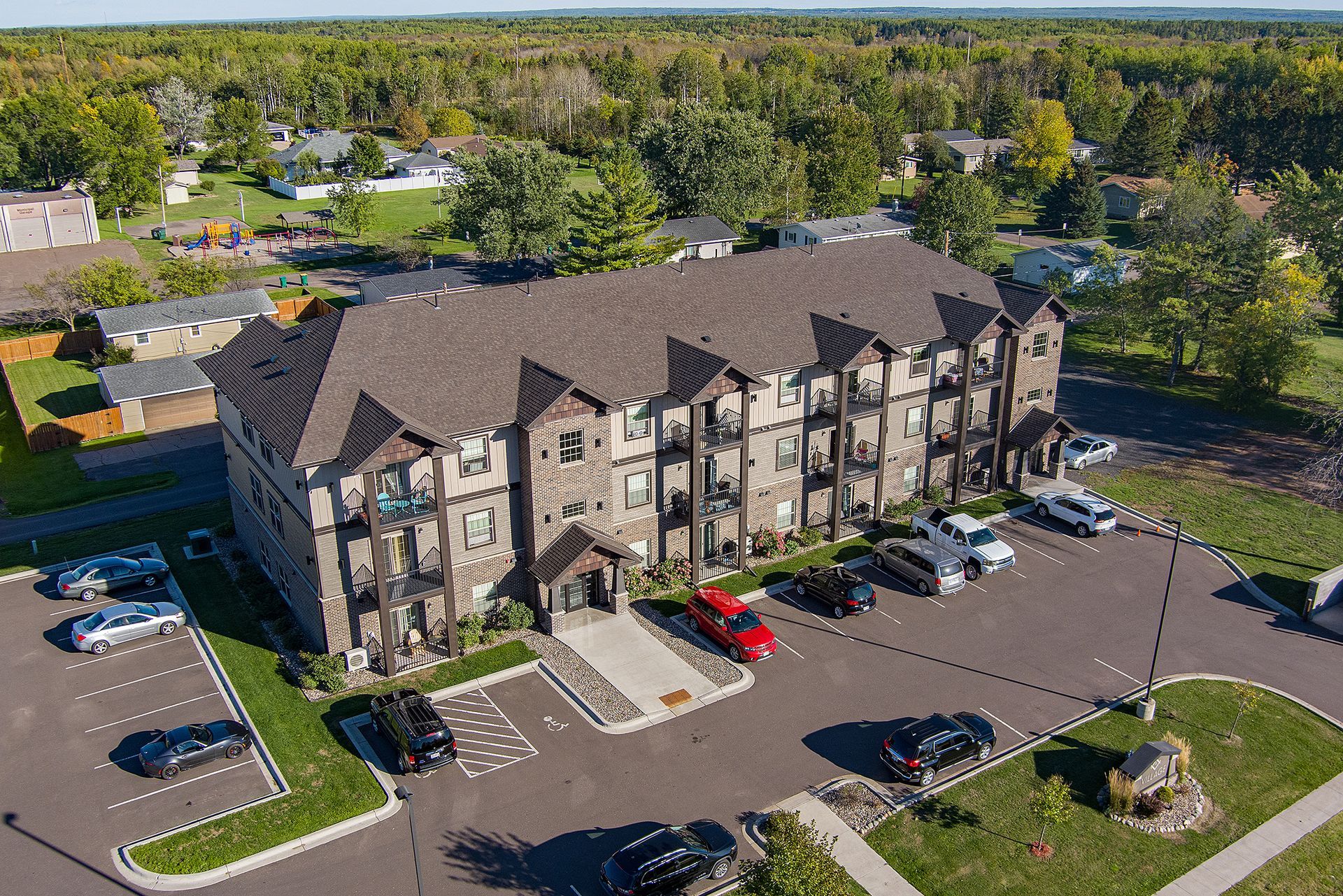 Village Apartments of superior aerial view