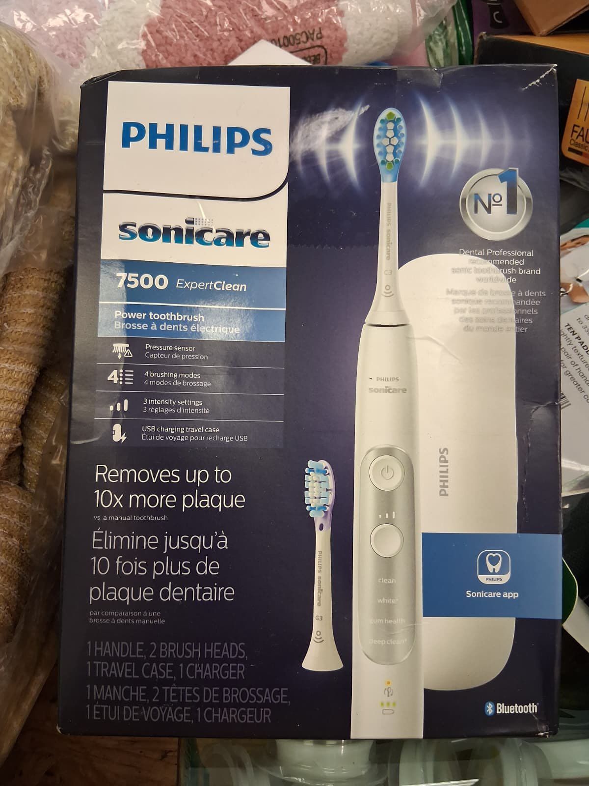 Philips Sonicare 7500 electric toothbrush box. The box is blue and white with a picture of the toothbrush and travel case.