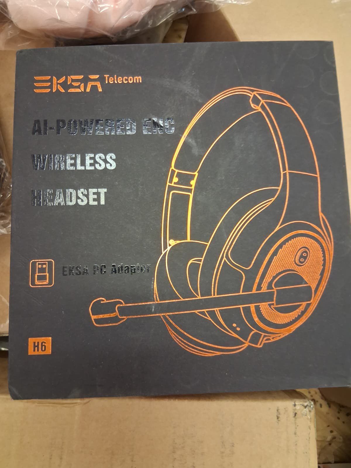Black and orange EKSA AI-powered wireless headset box, featuring a headset illustration. The box is dark gray, with orange text and accents.