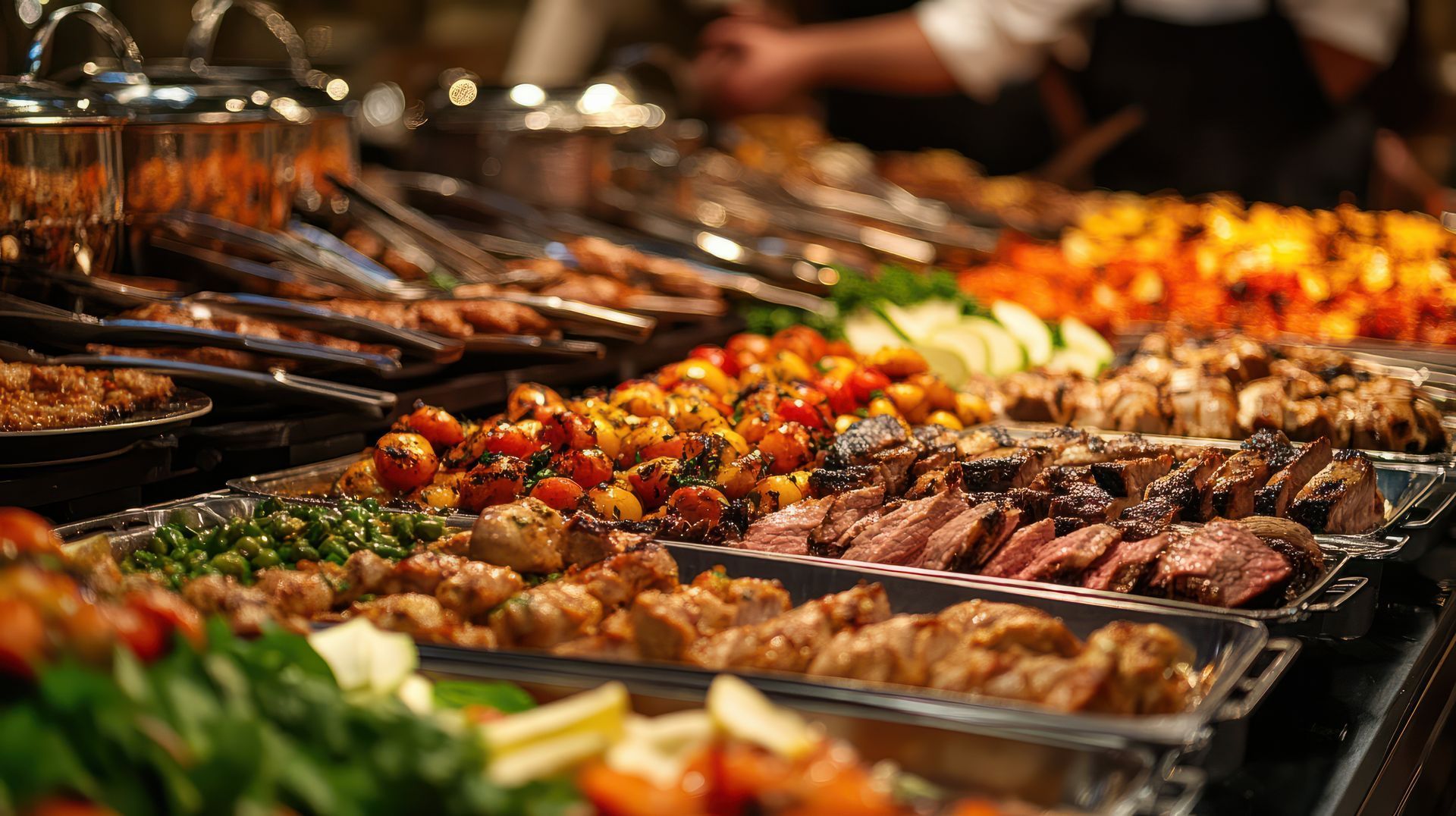 A buffet table filled with lots of different types of food.
