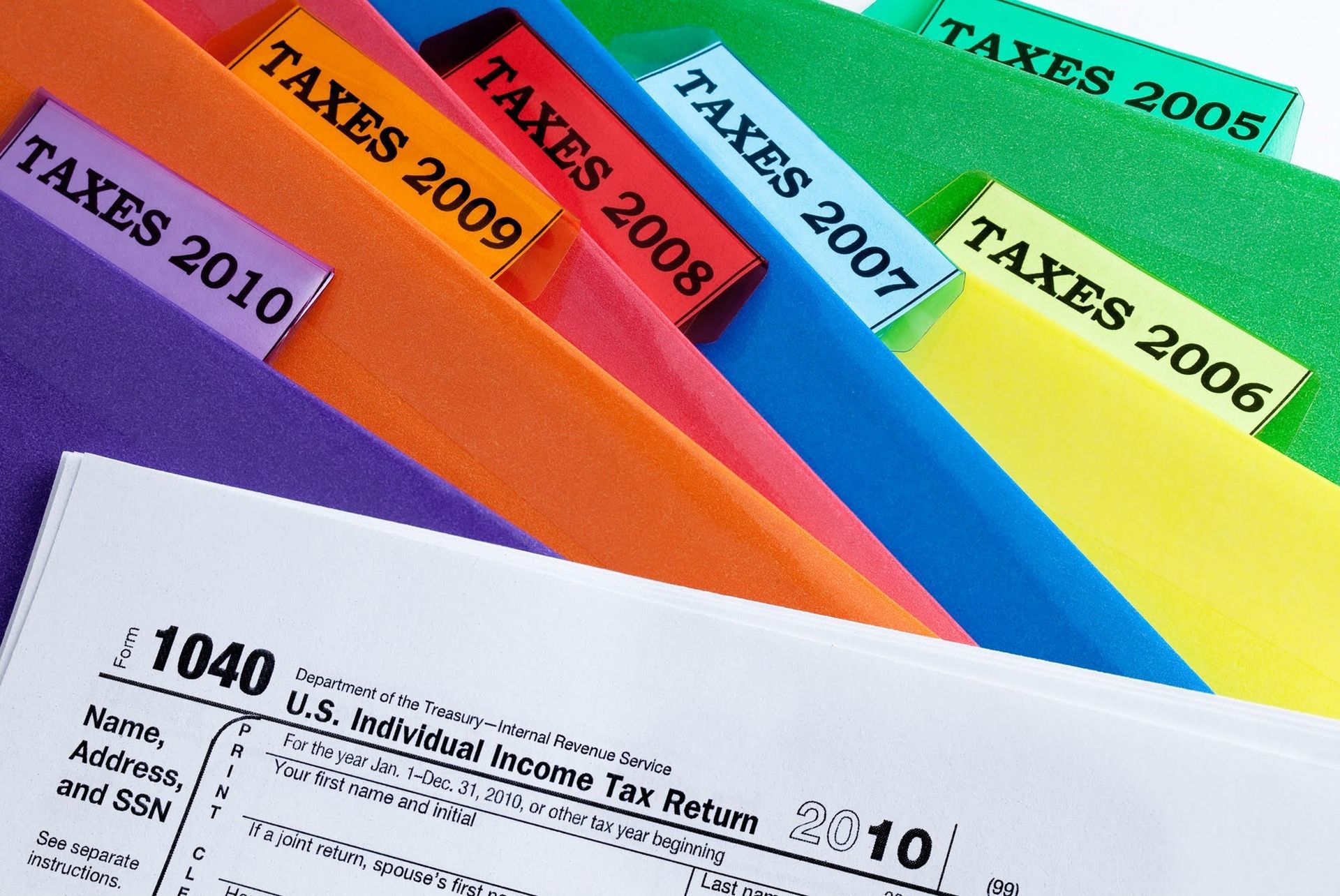 A Bunch of Folders with Labels of Taxes in Different Years — Elmhurst, IL — IRS Trouble Solvers, LLC