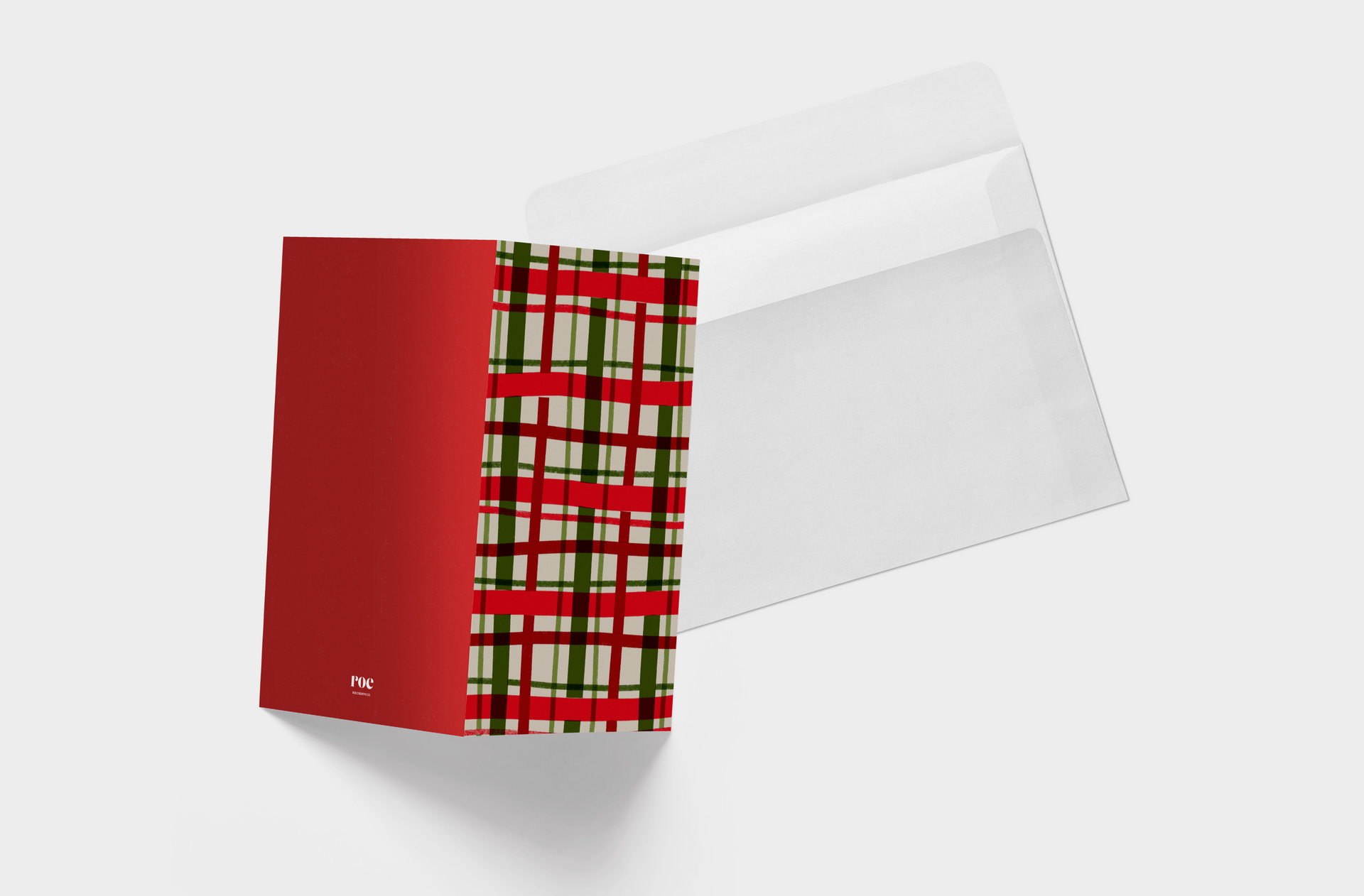 A christmas card with a red , green and white plaid pattern