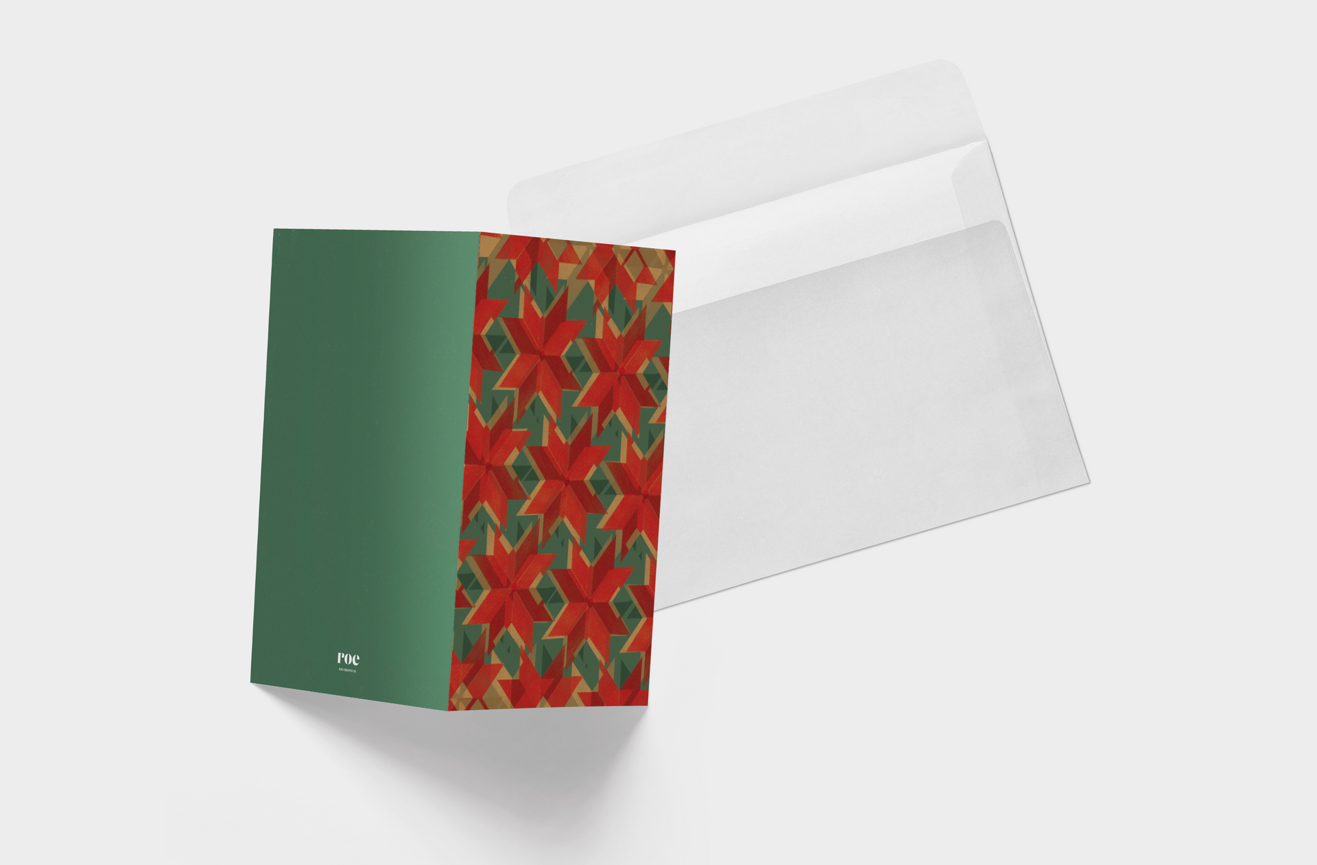 A greeting card with a red and green geometric pattern on it