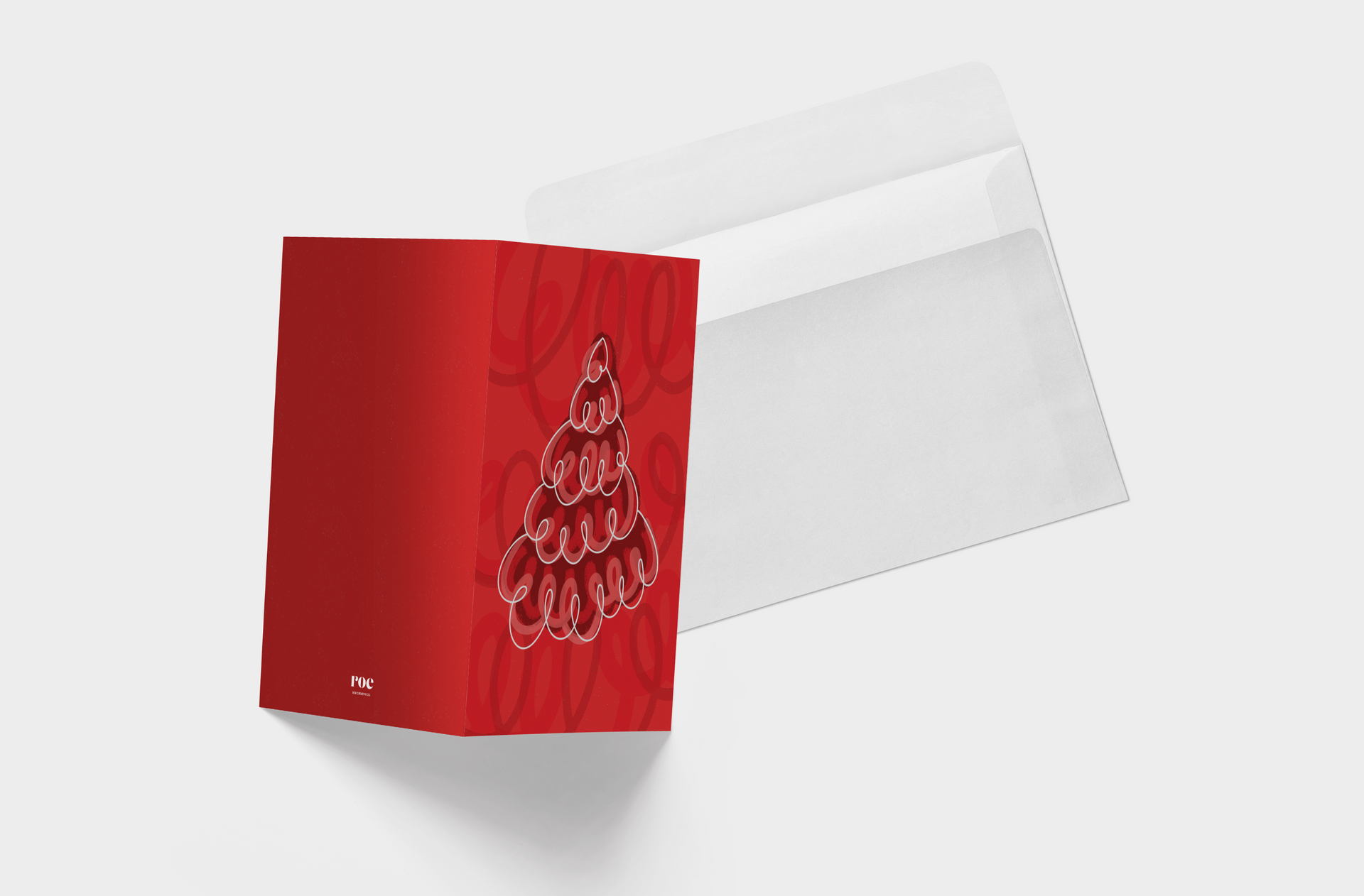 A red christmas card with a christmas tree made of spirals