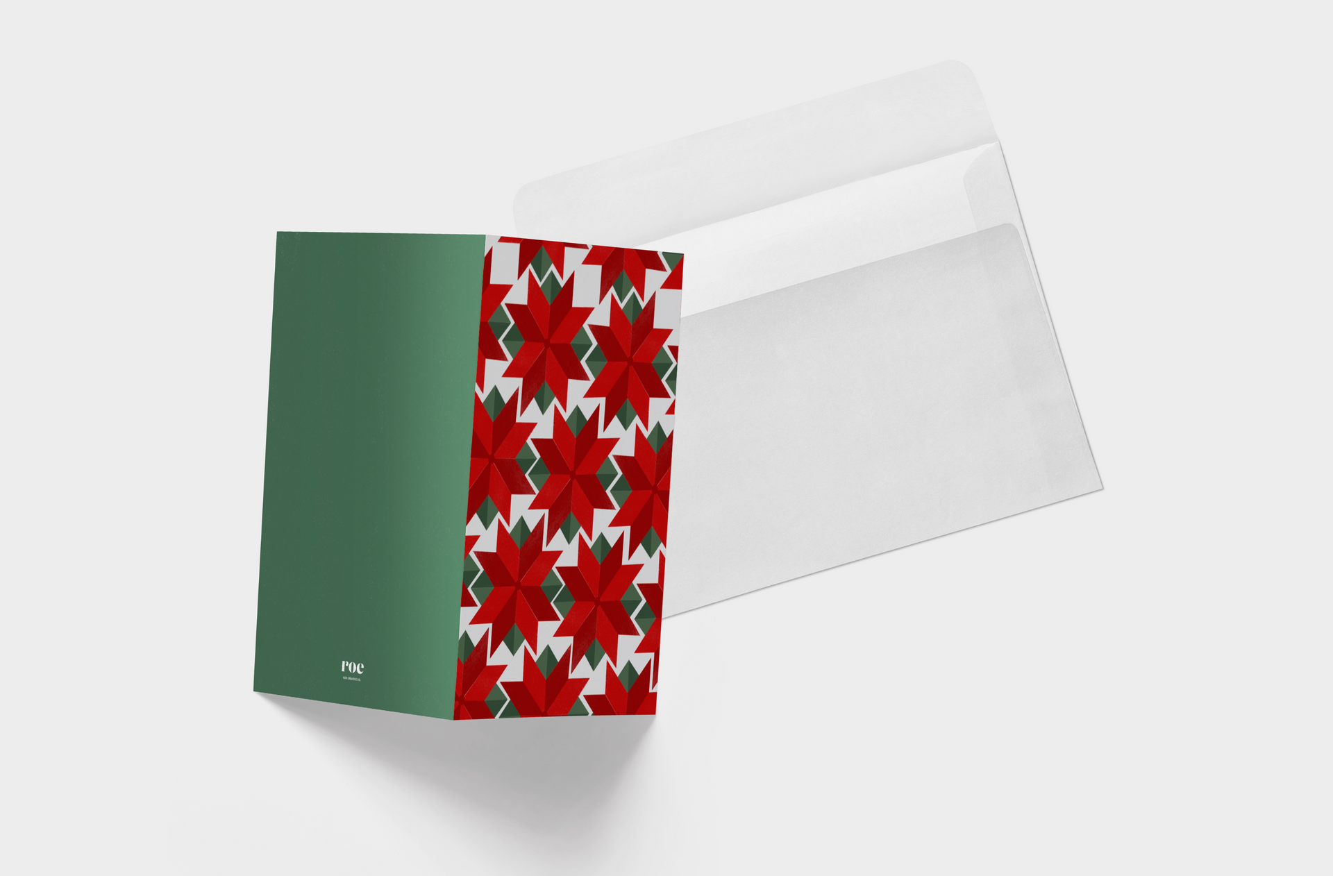 A christmas card with a red and green pattern on it