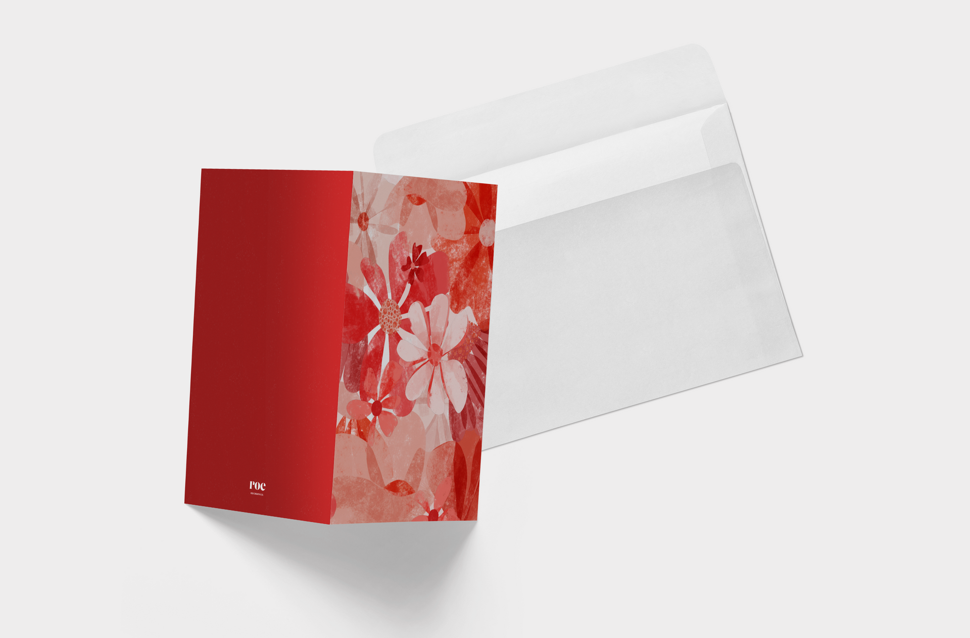 A greeting card with red flowers on it