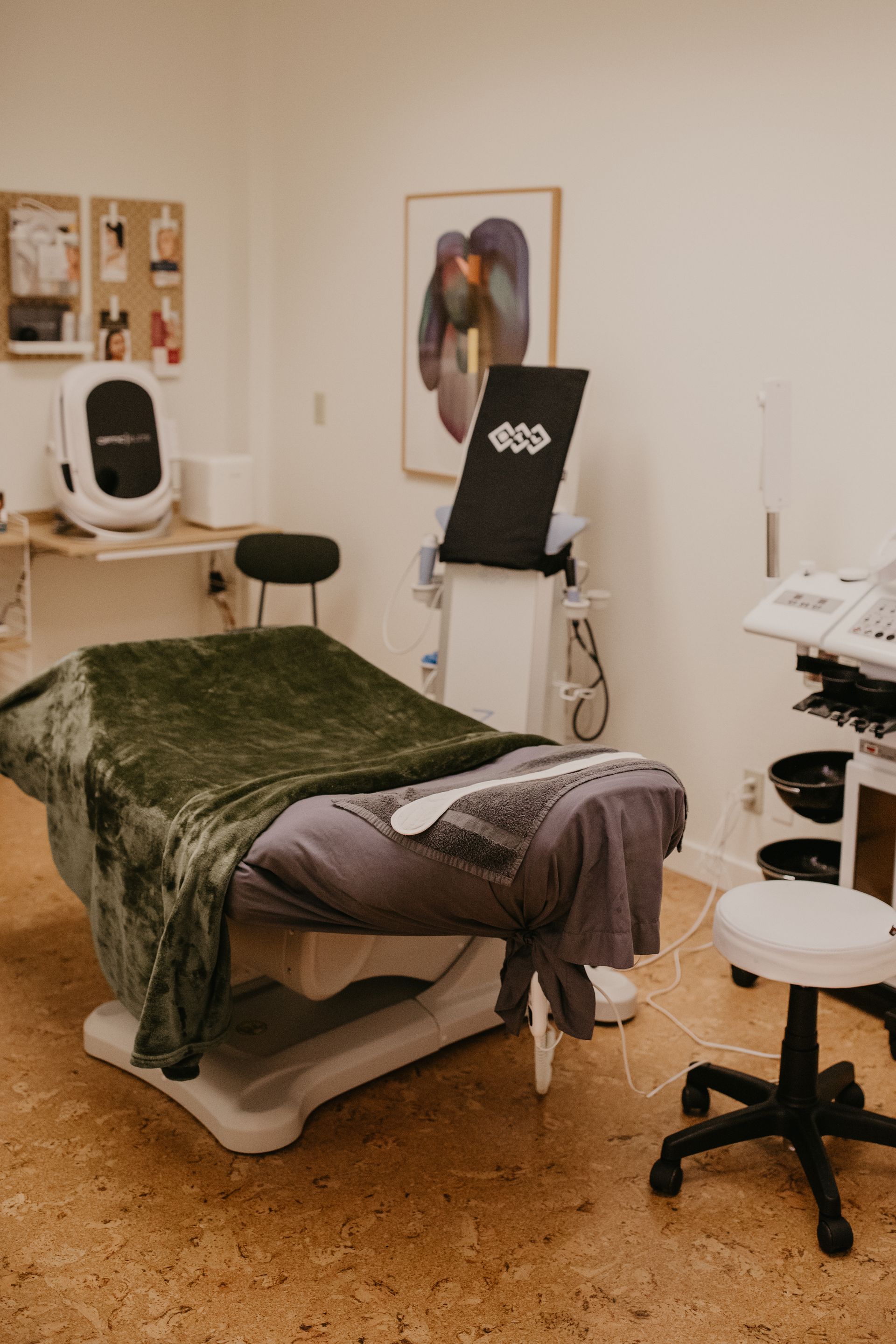 There is a massage table in the middle of the room.