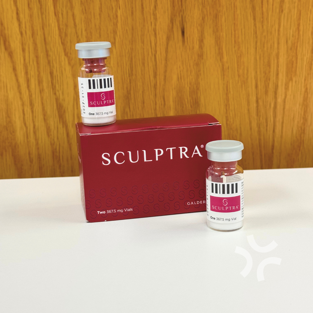 Two bottles of sculptra are sitting next to a box