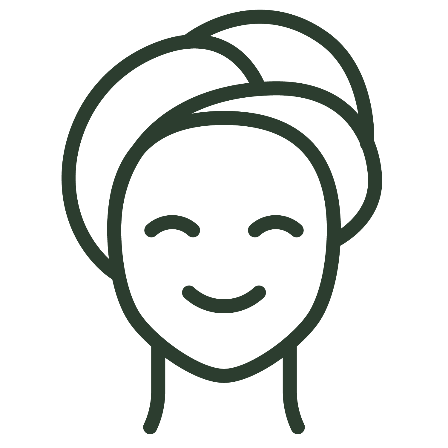 A woman with a towel wrapped around her head is smiling.