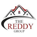 Logo for The Reddy Group: a black and red house silhouette with the company name.