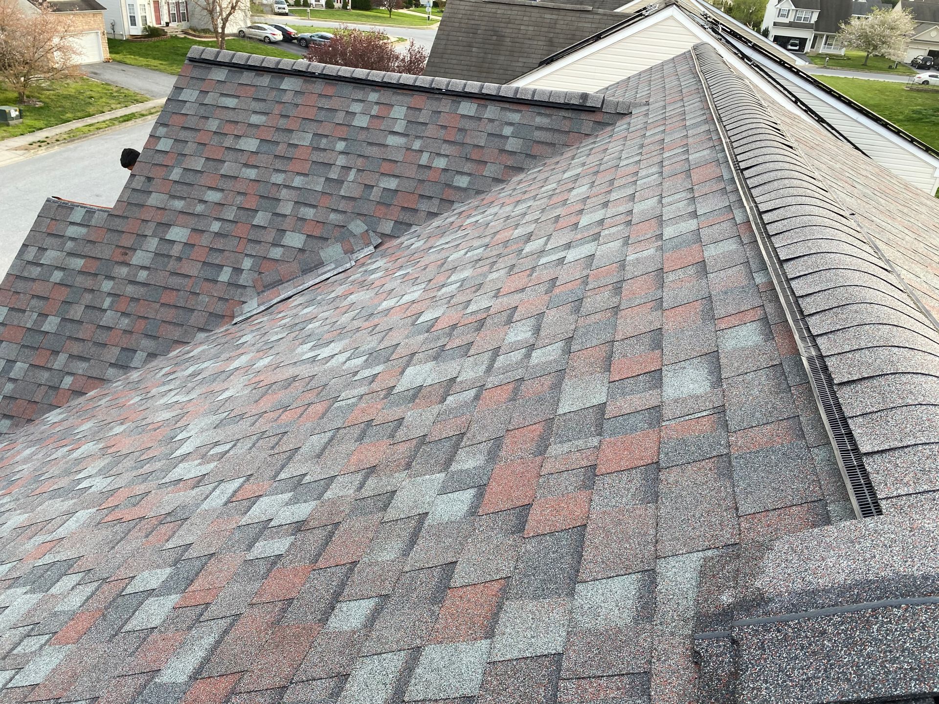 A close up of a roof with a lot of shingles on it.
