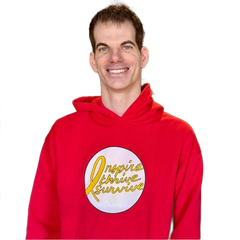 Man in red hoodie smiles,