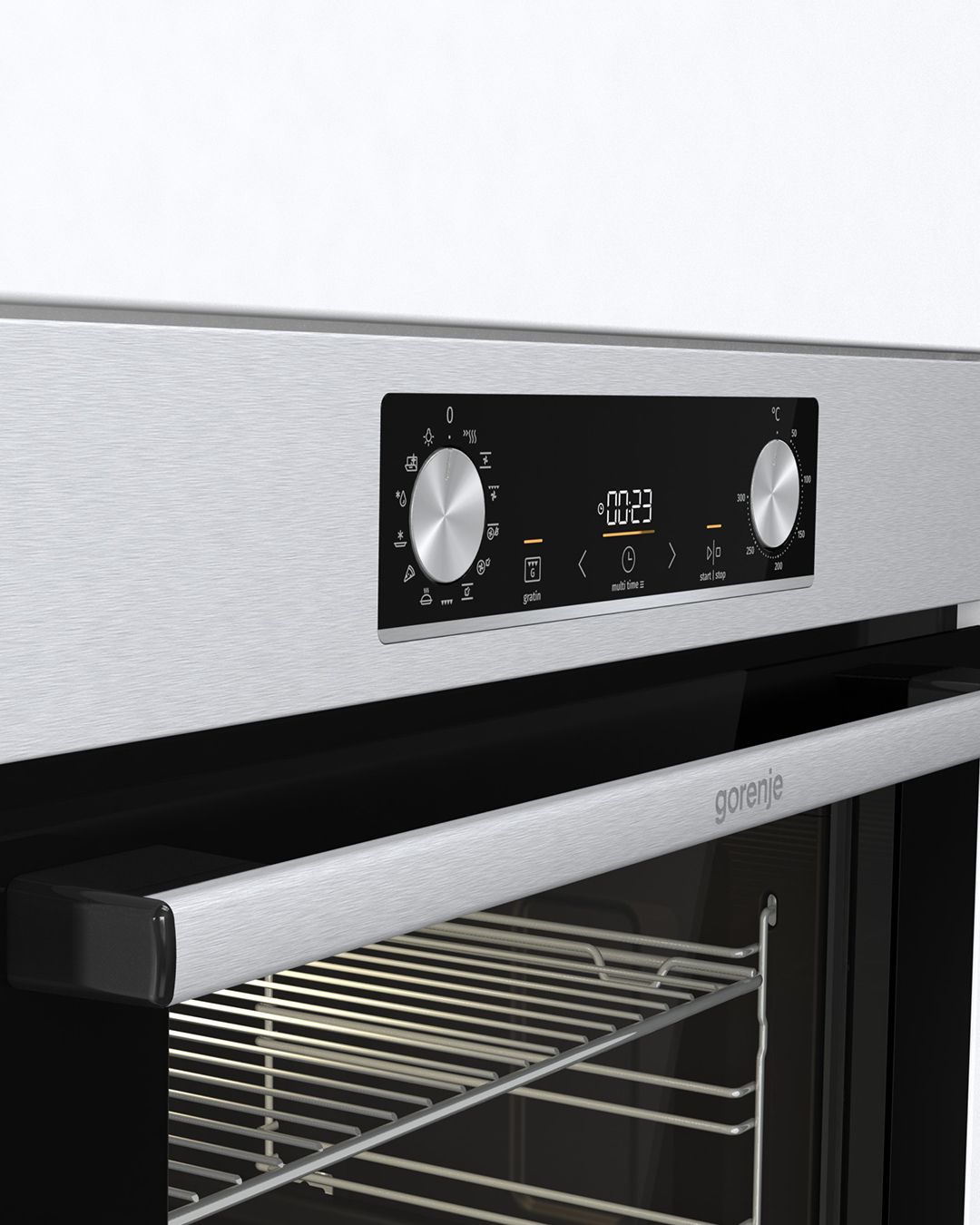 Um close de um forno de aço inoxidável com display digital