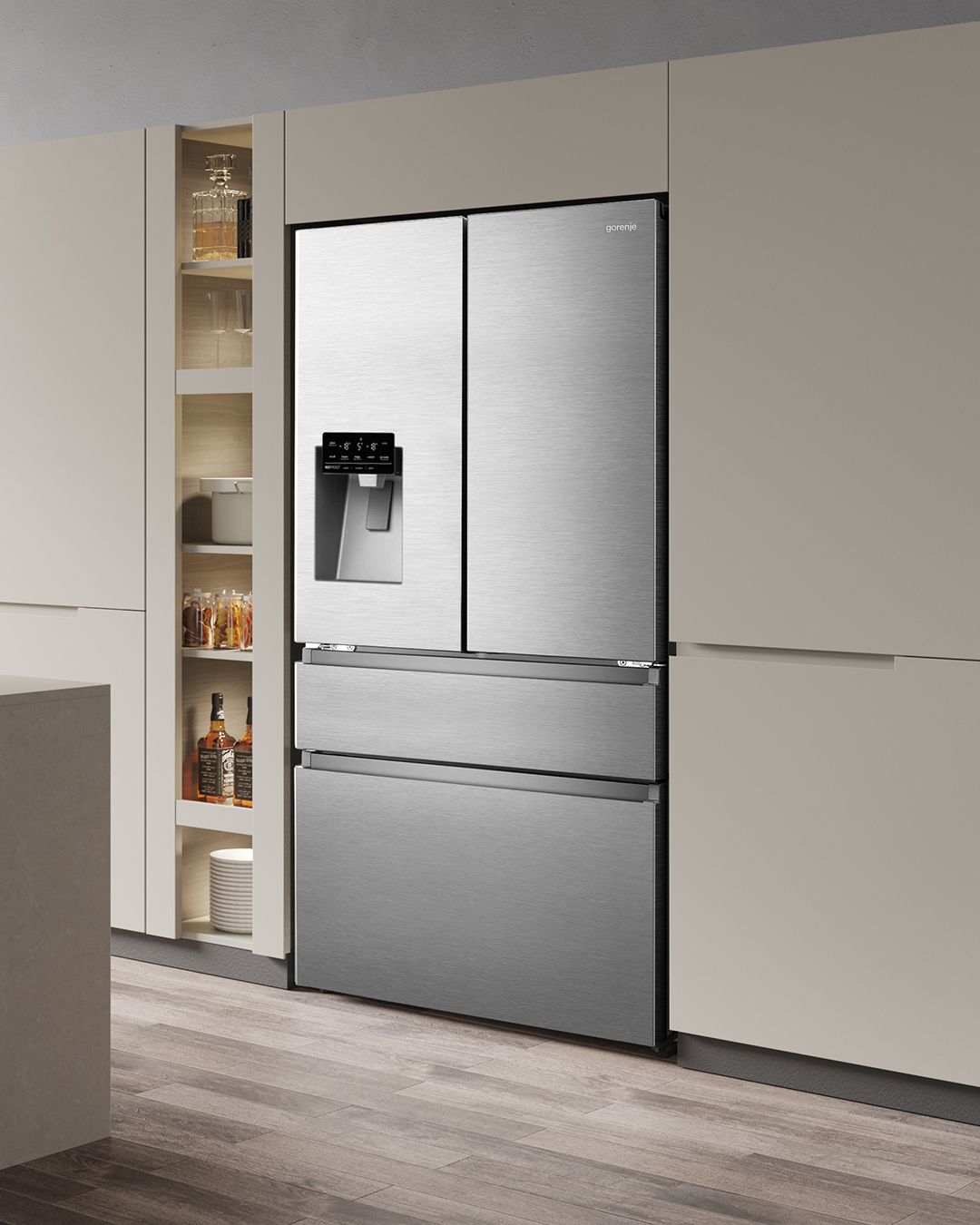 Uma geladeira de aço inoxidável com dispensador de água em uma cozinha