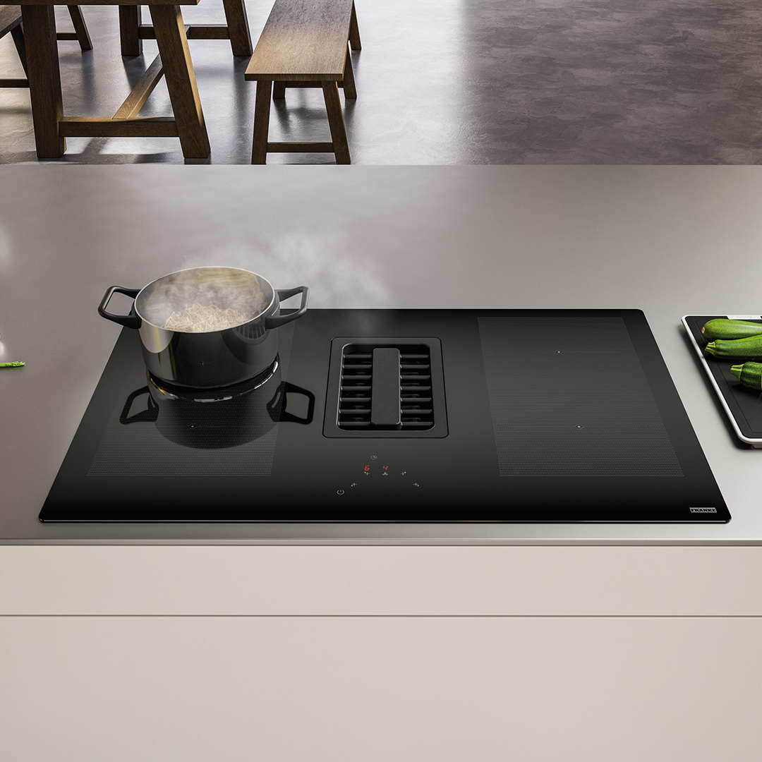 Uma panela está cozinhando em um fogão preto