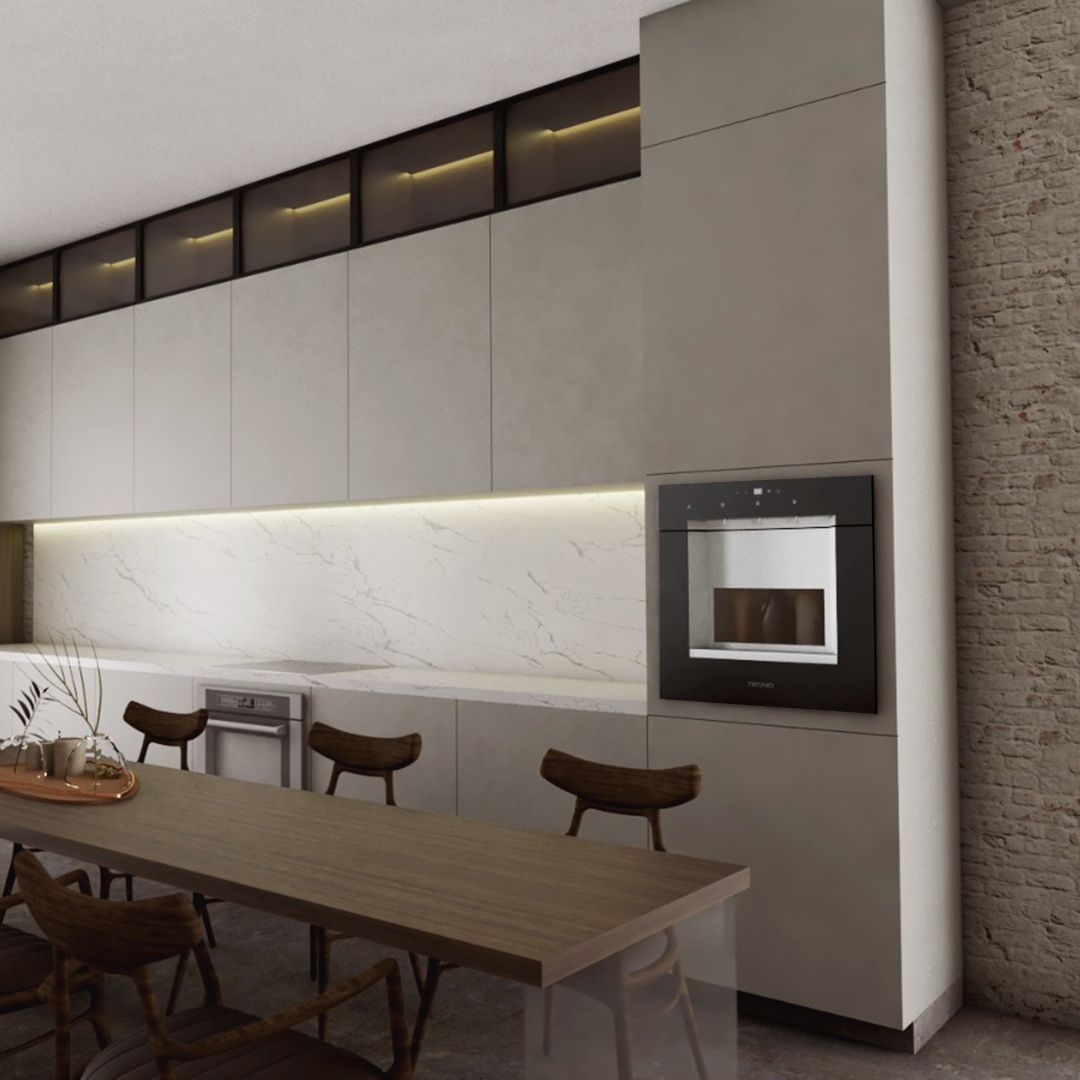 Uma cozinha com mesa e cadeiras e forno