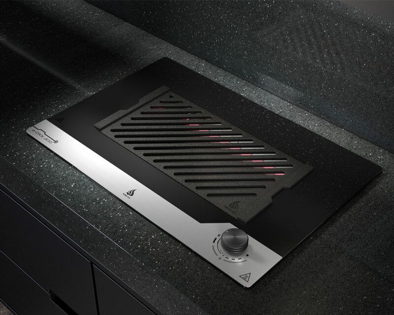 Um fogão preto e prateado com uma grelha