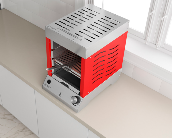 Um forno vermelho está em um balcão próximo a uma janela