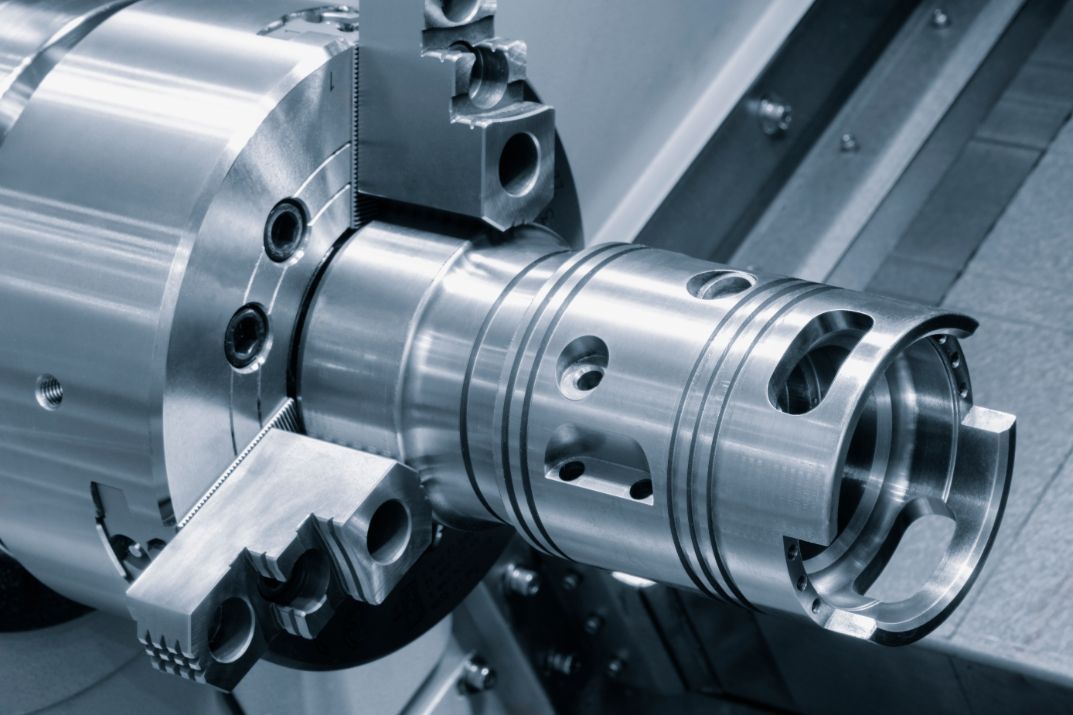 A close up of a metal object on a machine