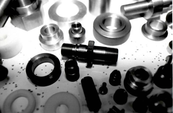 A bunch of metal parts are laying on a table