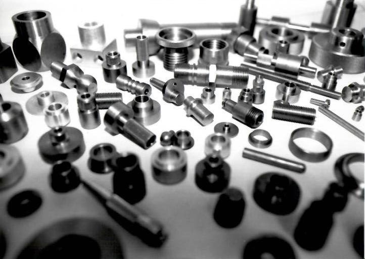 A bunch of metal parts are laying on a table