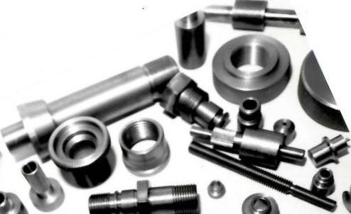 A bunch of metal parts on a white surface