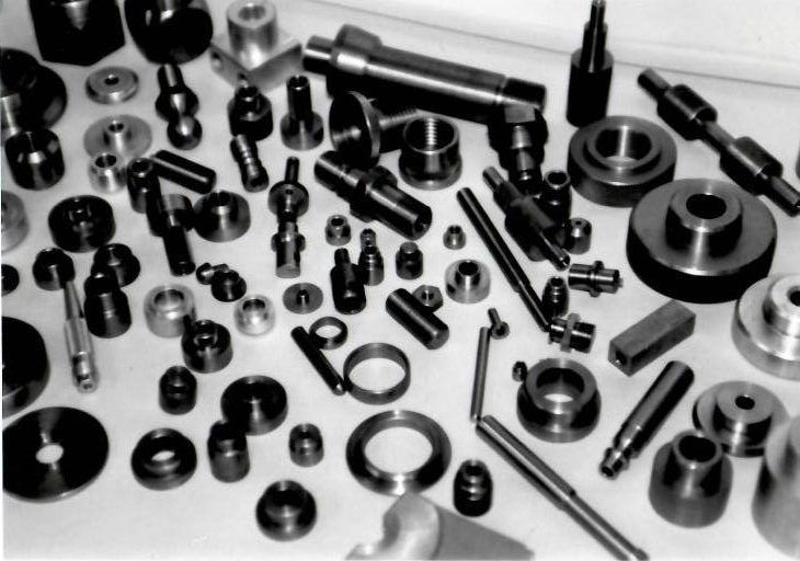 A black and white photo of a bunch of metal parts